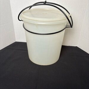 Vtg canister from Tupperware, white or opaque in color with black handle